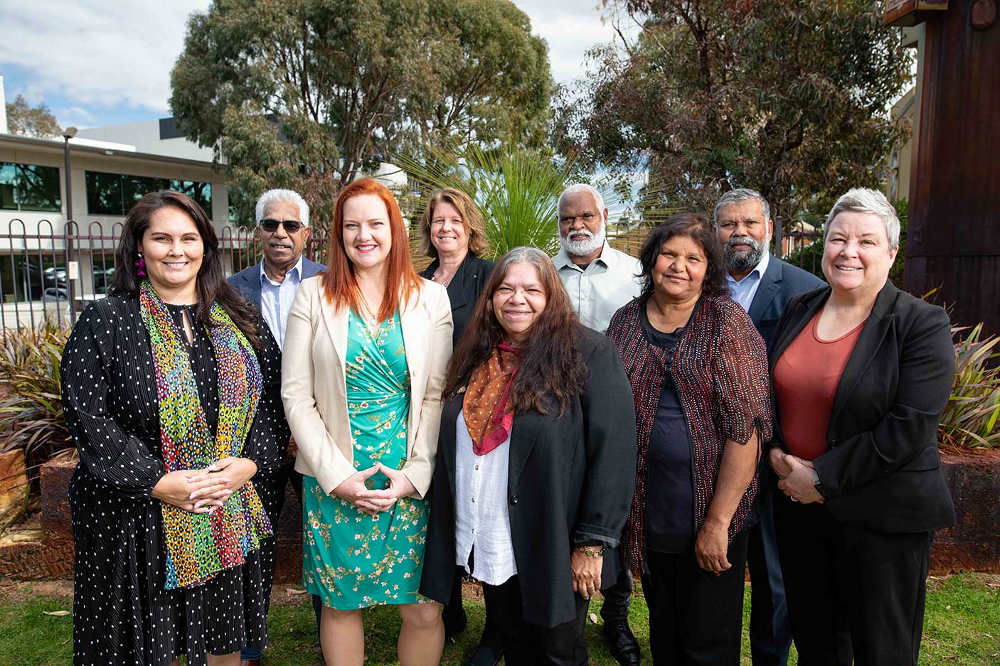 A group of people standing together outside