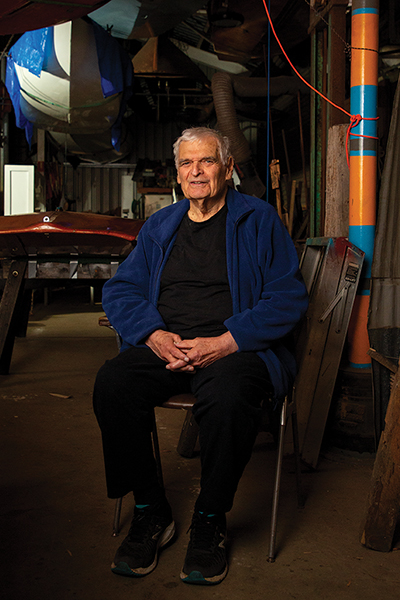 Tony Jones is seated whilst posing for a photographic portrait