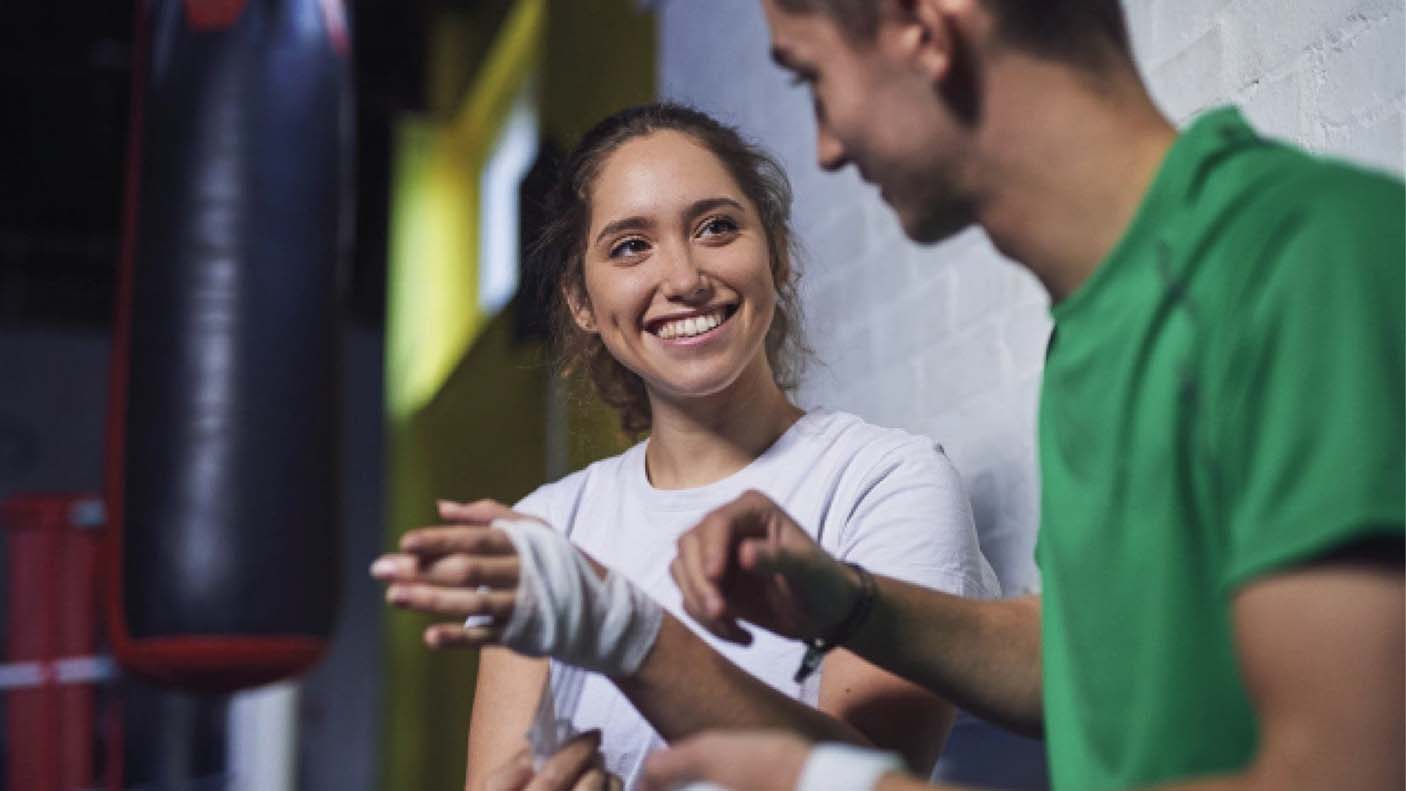 A woman strapping up her hand