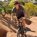 A boy on a bike on the pump track