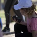 A girl using a radio playing lost pilot